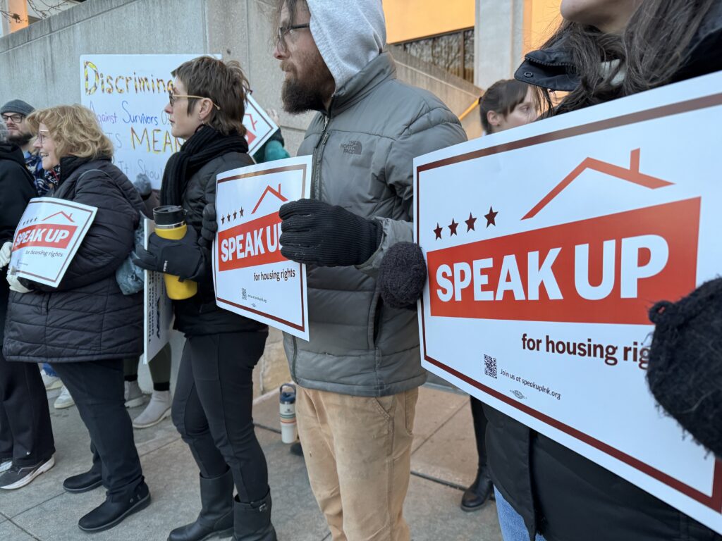 Supporters of a proposed source-of-income discrimination ban in Lincoln rally in front of the Lincoln City Council offices on Monday, Dec. 18, 2023.